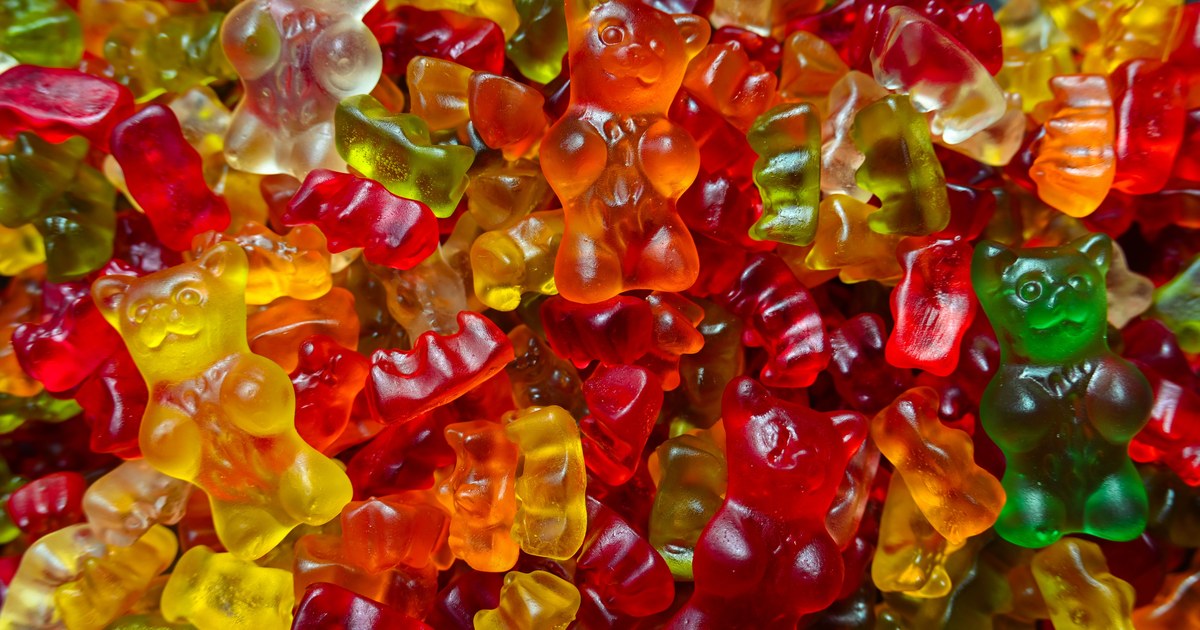 A pile of translucent multicolored gummy bear candies